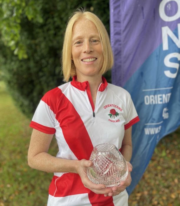 Alison holding the VHI Individual day trophy on behalf of the England team